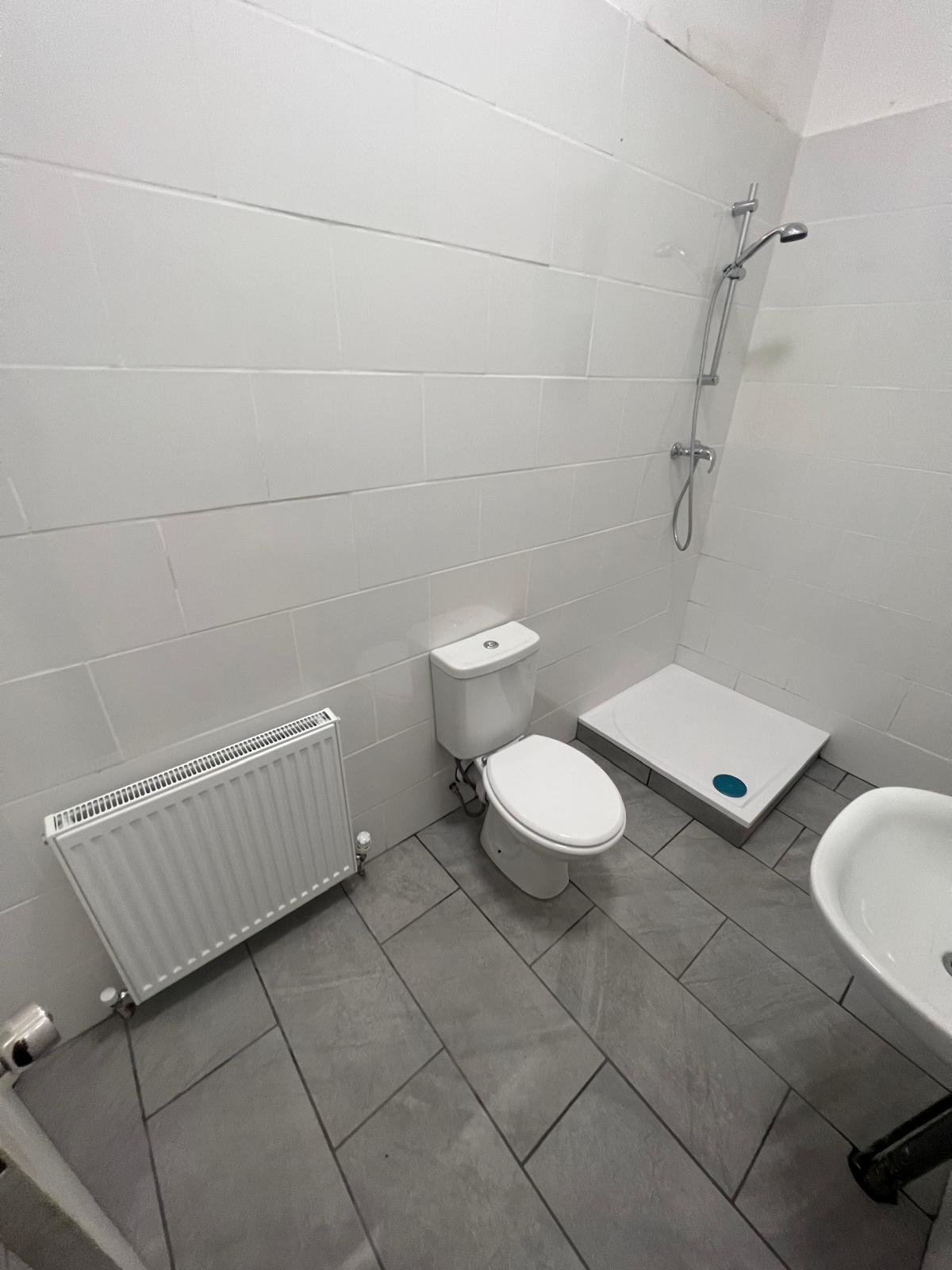 Fully tiled family bathroom in a London home