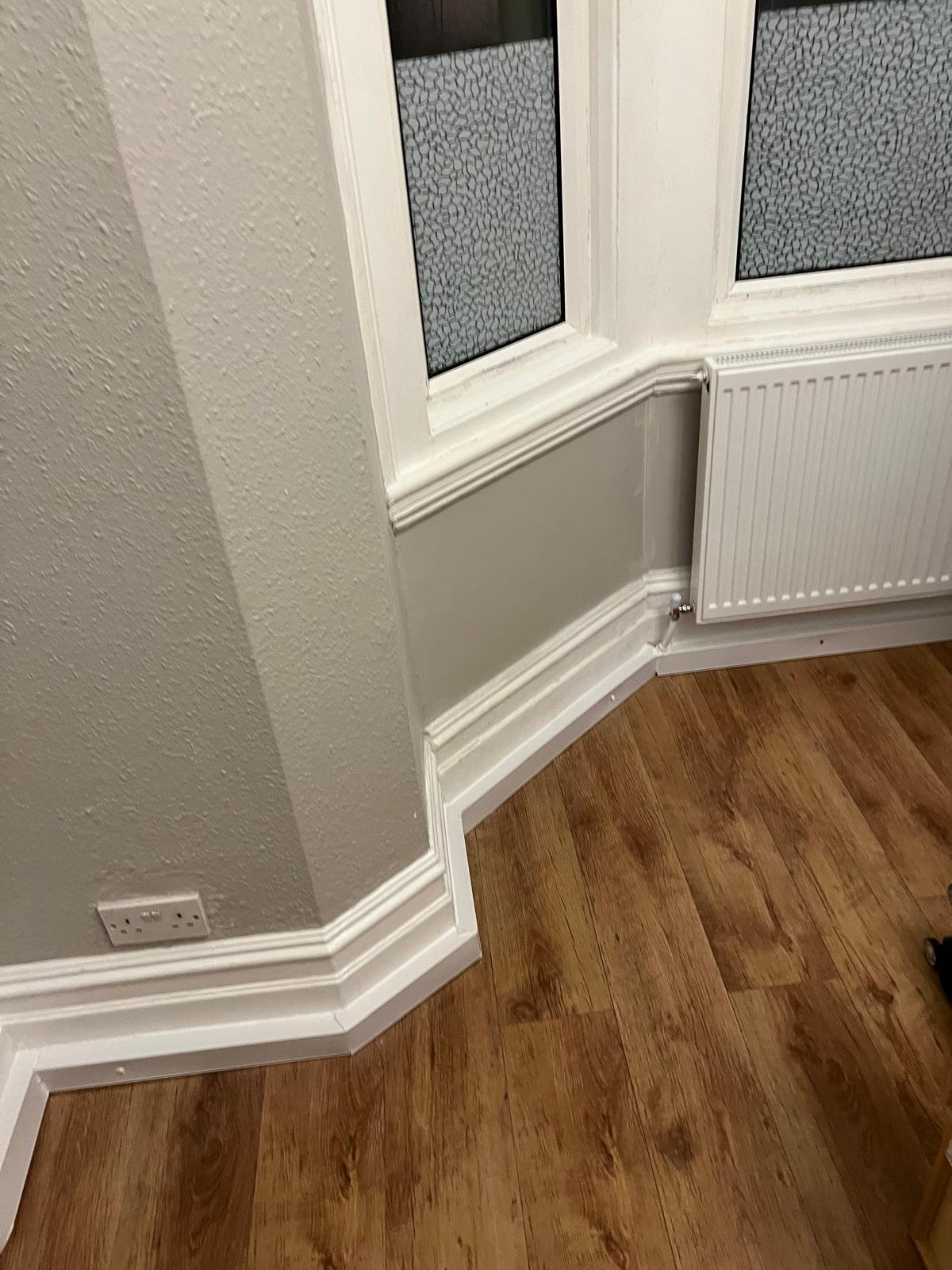 Restored bay window reception room with new flooring